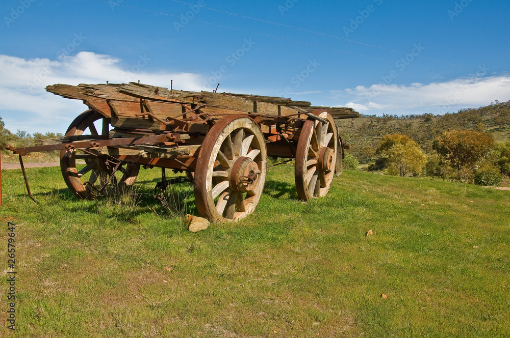 old wagon next a farm in australian landscape