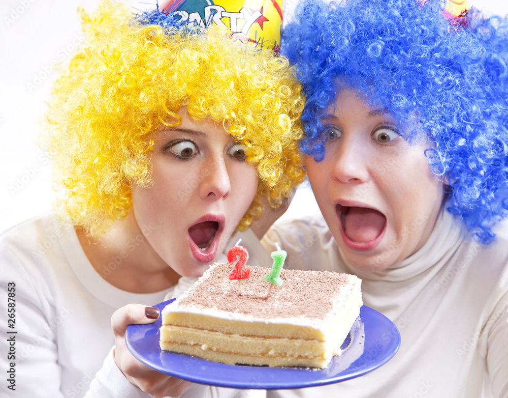 Two girlfriends with cake and wig celebrate 21th birthday Two girlfriends with cake and wig celebrate 21th birthday