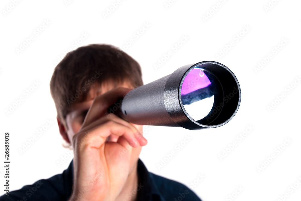 man looking through a telescope
