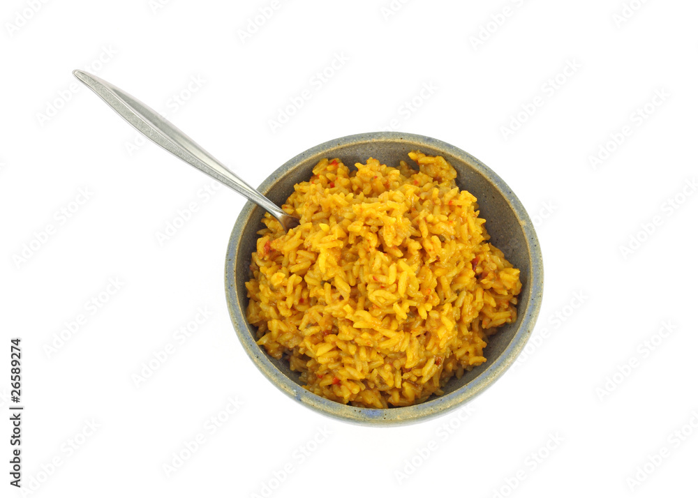 Seasoned rice in stoneware bowl with fork Seasoned rice in stoneware bowl with fork