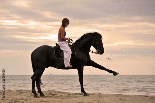 girl and horse on the beach
