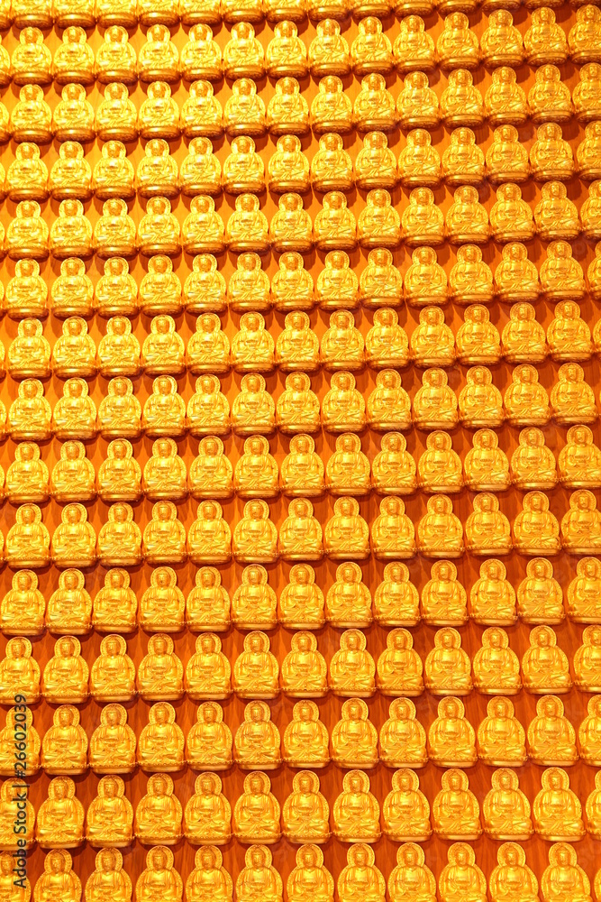 Fototapeta premium Golden buddha on wooden wall