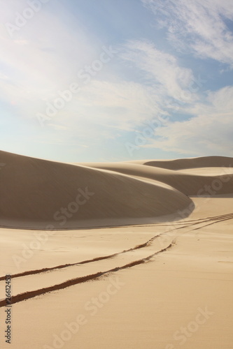 Sand dunes with tyre tracks