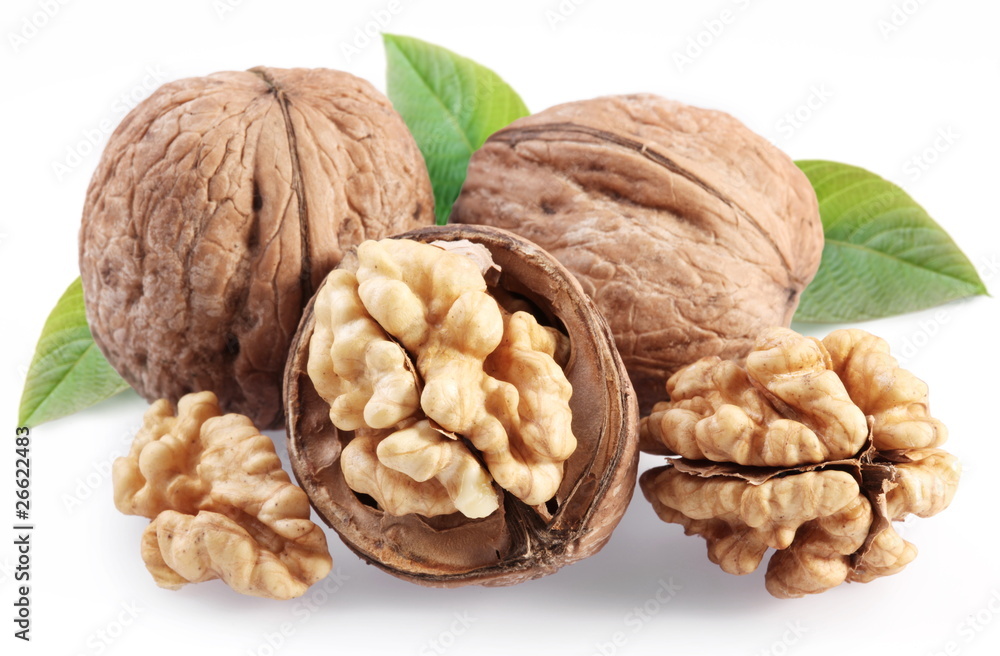 Walnuts with leaf isolated on a white background. Walnuts with leaf isolated on a white background.