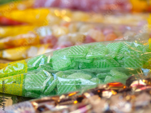 market stand of colorful candies in the package