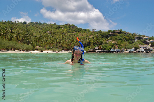 Woman snorkelling near the beautiful tropical beach © Iuliia Sokolovska
