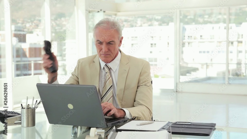Businessman Multitasking at the Office Businessman Multitasking at the Office