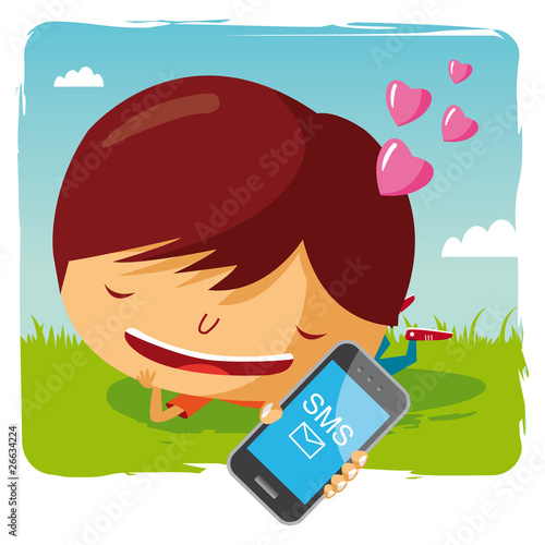 garçon amoureux allongé dans l'herbe et téléphone mobile - sms