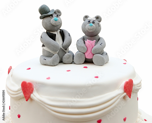 Сouple of bears on top of cake are made of marzipan