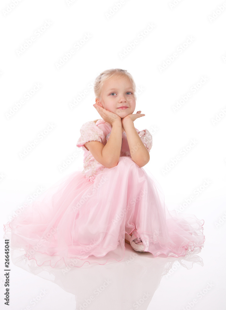 little girl in a pink elegant dress.White background little girl in a pink elegant dress.White background