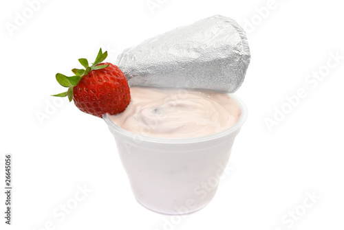 Fruit yogurt in plastic container on white background
