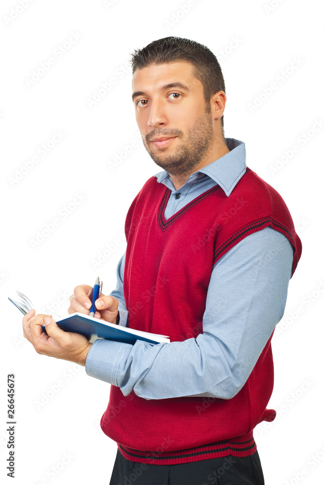 Executive man holding agenda and pencil Executive man holding agenda and pencil