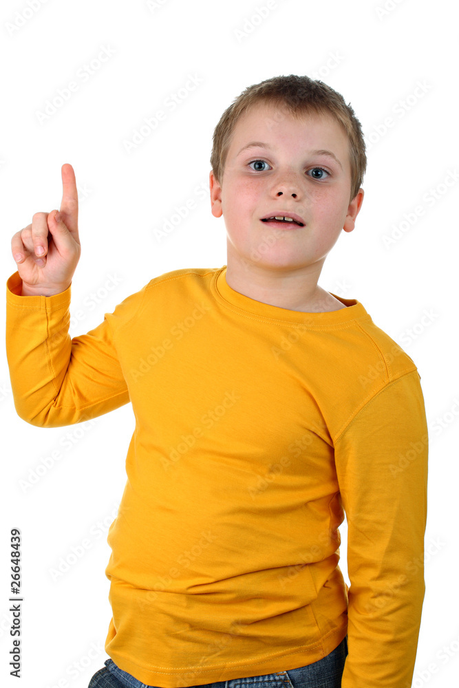 Delighted young boy points his finger up isolated on white Delighted young boy points his finger up isolated on white