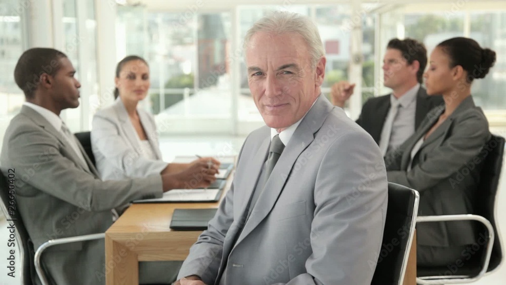 Businessman Posing at a Meeting Businessman Posing at a Meeting