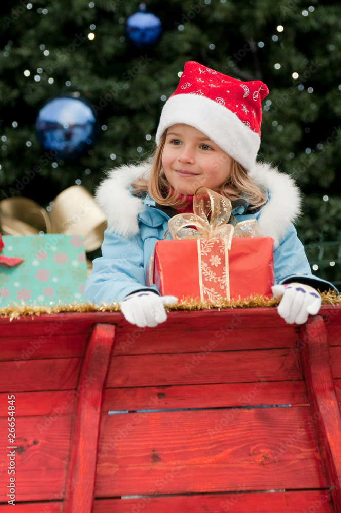 Little girl in Santa Claus sledge Little girl in Santa Claus sledge