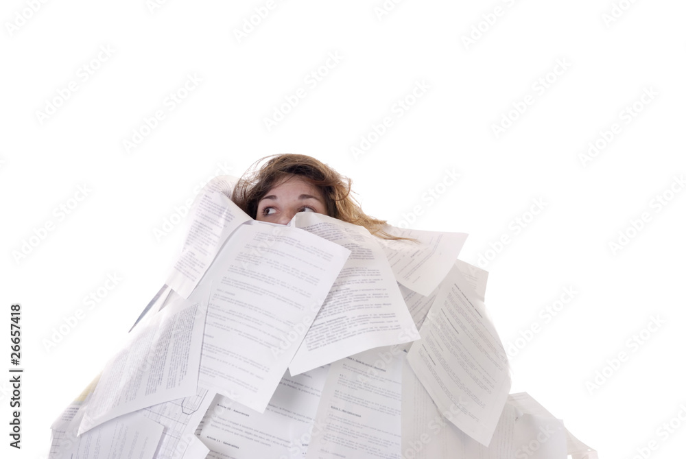 business concept:young woman drowning in papers business concept:young woman drowning in papers