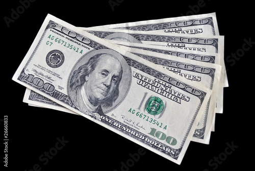 five bills on one hundred dollars on black background.