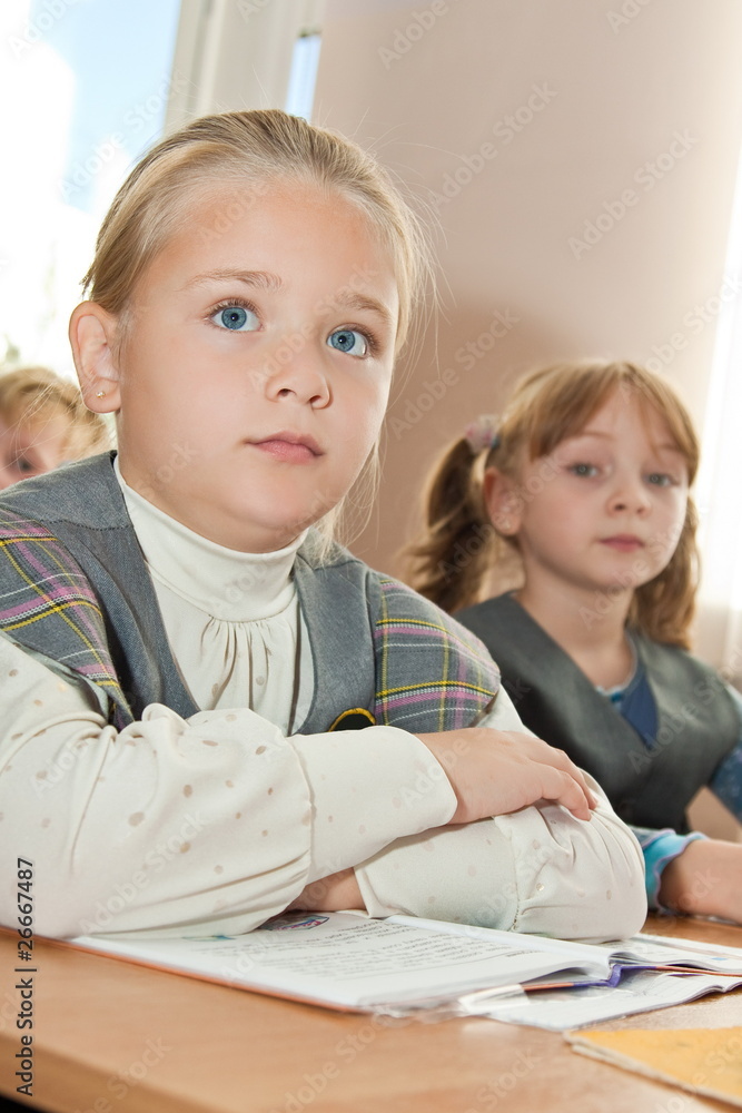Thoughtful schoolgirls in classroom Thoughtful schoolgirls in classroom