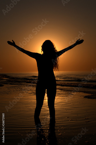 Silhouette of a woman on the beach