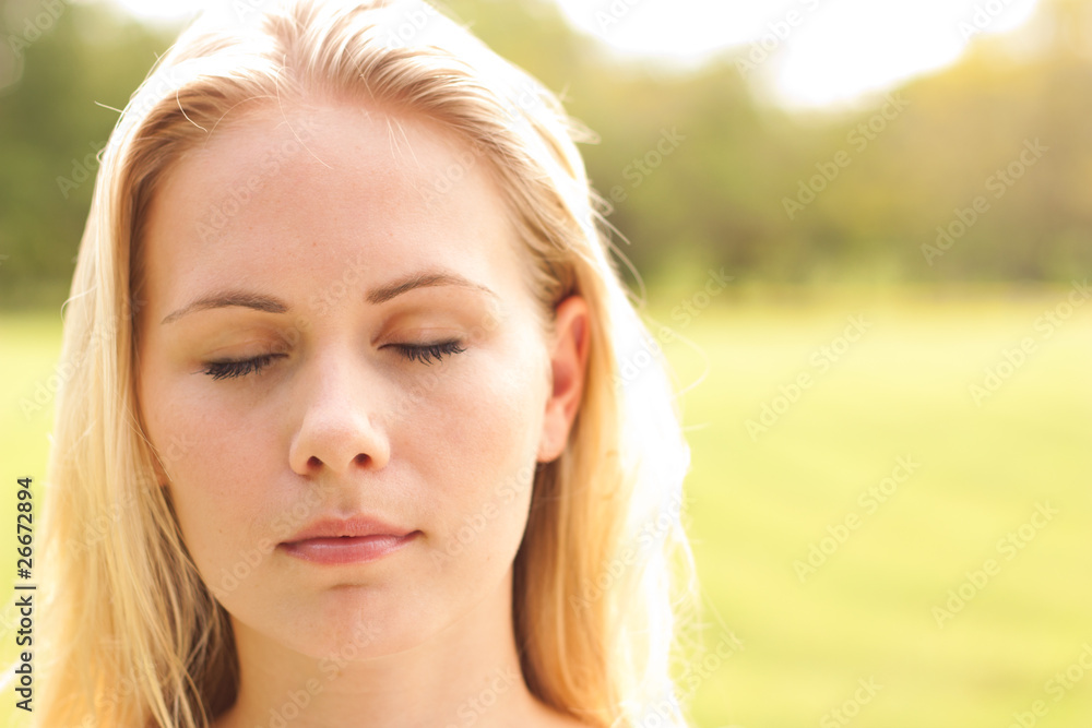 Closeup portrait of young lady with closed eyes Closeup portrait of young lady with closed eyes
