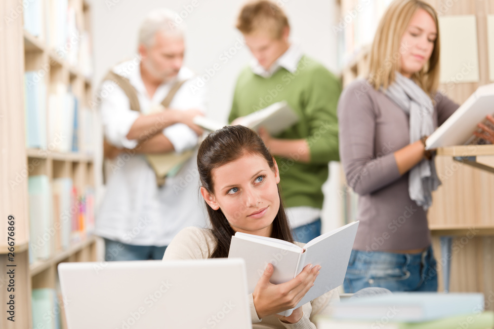 High school library - Student with book High school library - Student with book