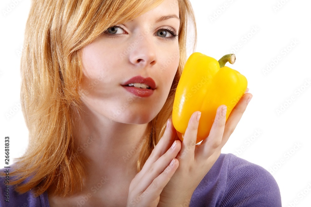 young beauty with yellow paprika (white background) young beauty with yellow paprika (white background)