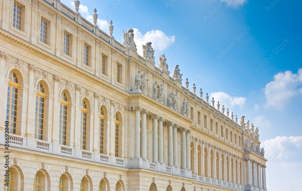 Palace side with statues on top in Versailles