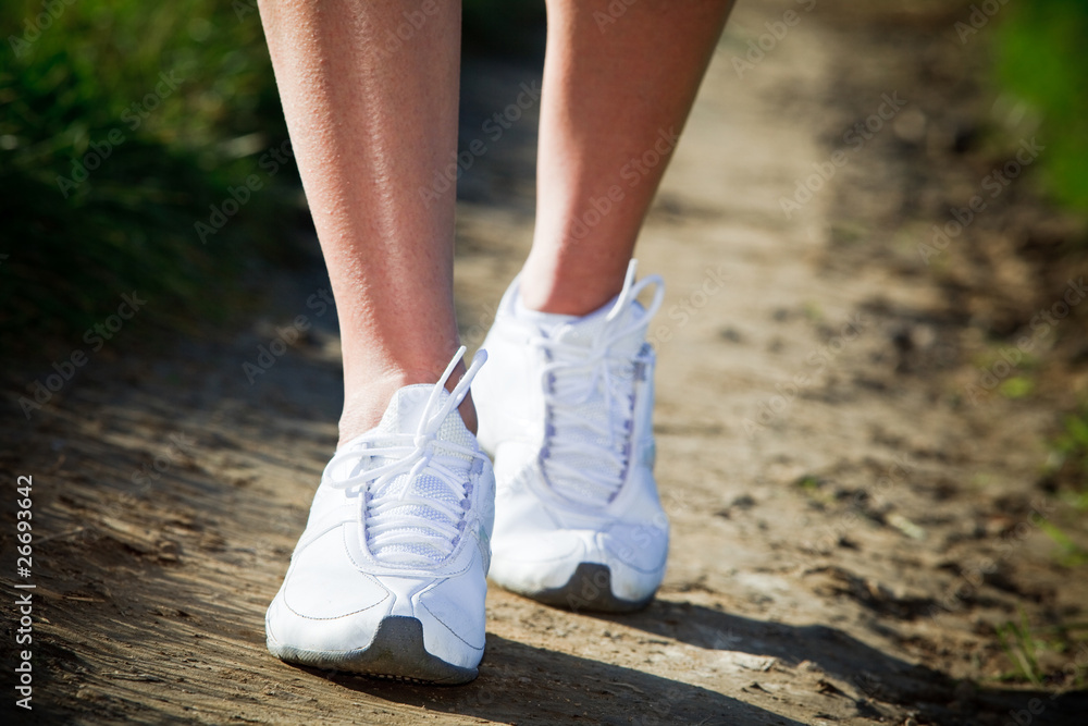 Woman walking cross country and trail Woman walking cross country and trail