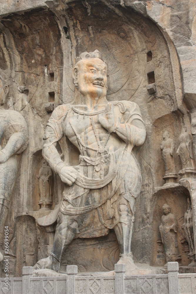 Longmen Caves in Luoyang. Statue of Warrior.