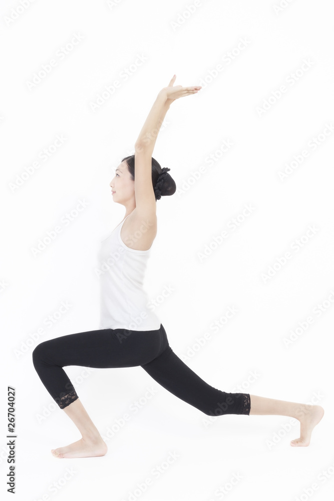 Asian model doing yoga on white background
