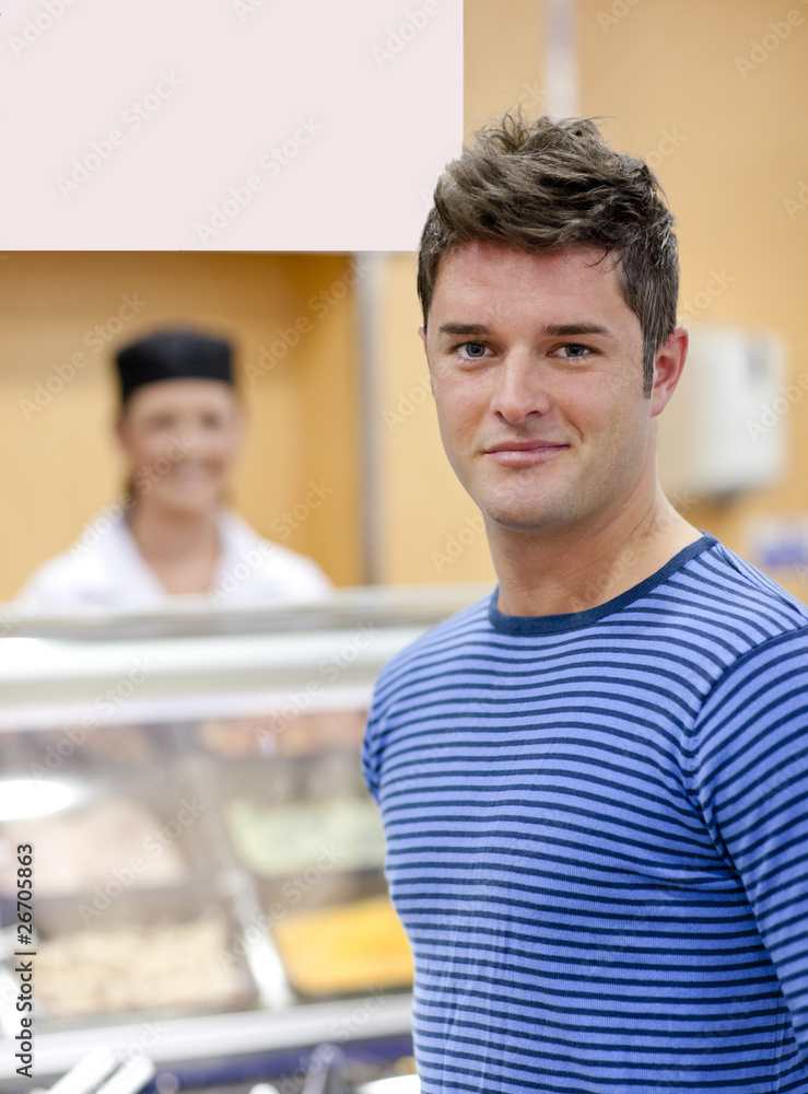 Portrait of a cheerful man choosing his lunch in the cafeteria Portrait of a cheerful man choosing his lunch in the cafeteria