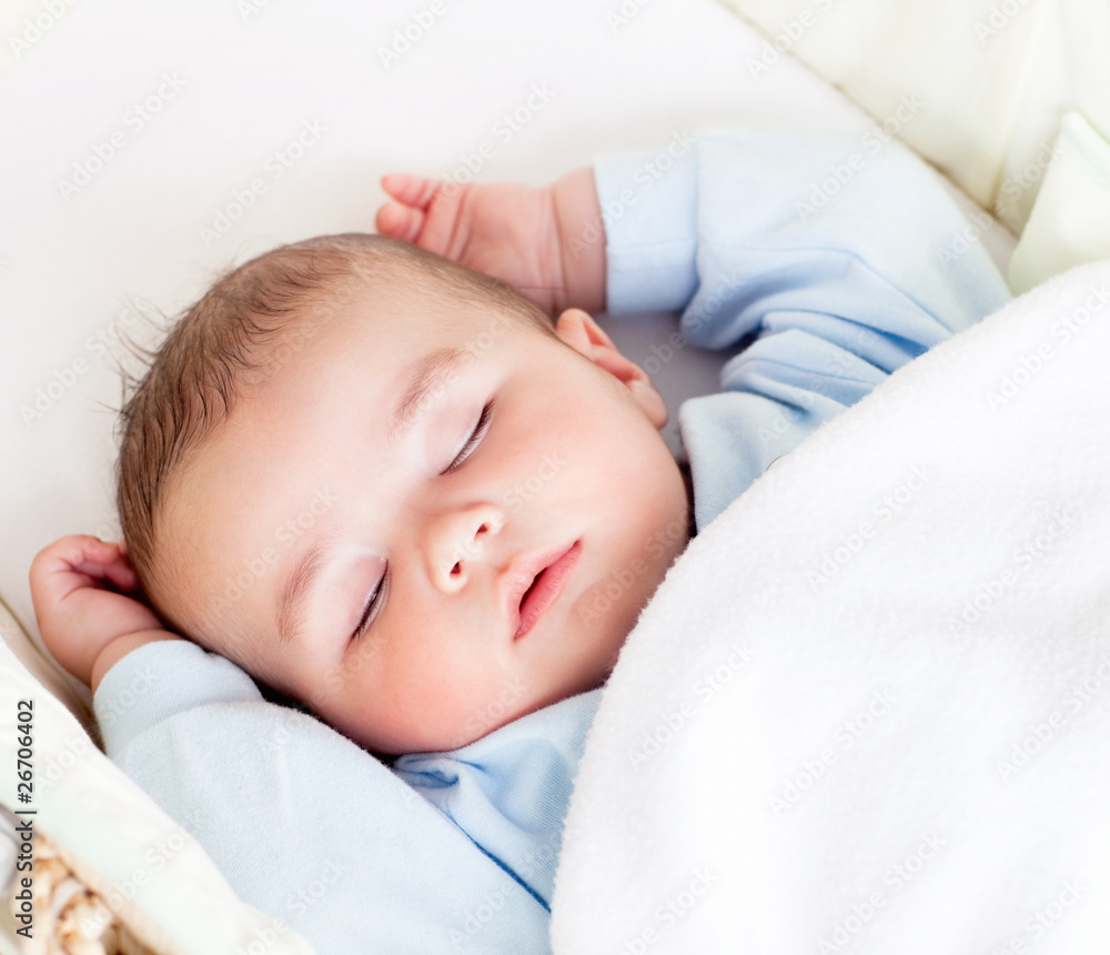 Portrait of a peaceful baby sleeping in his cradle at home Portrait of a peaceful baby sleeping in his cradle at home