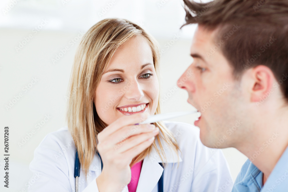 Portrait of a female doctor taking a saliva sample of a patient Portrait of a female doctor taking a saliva sample of a patient