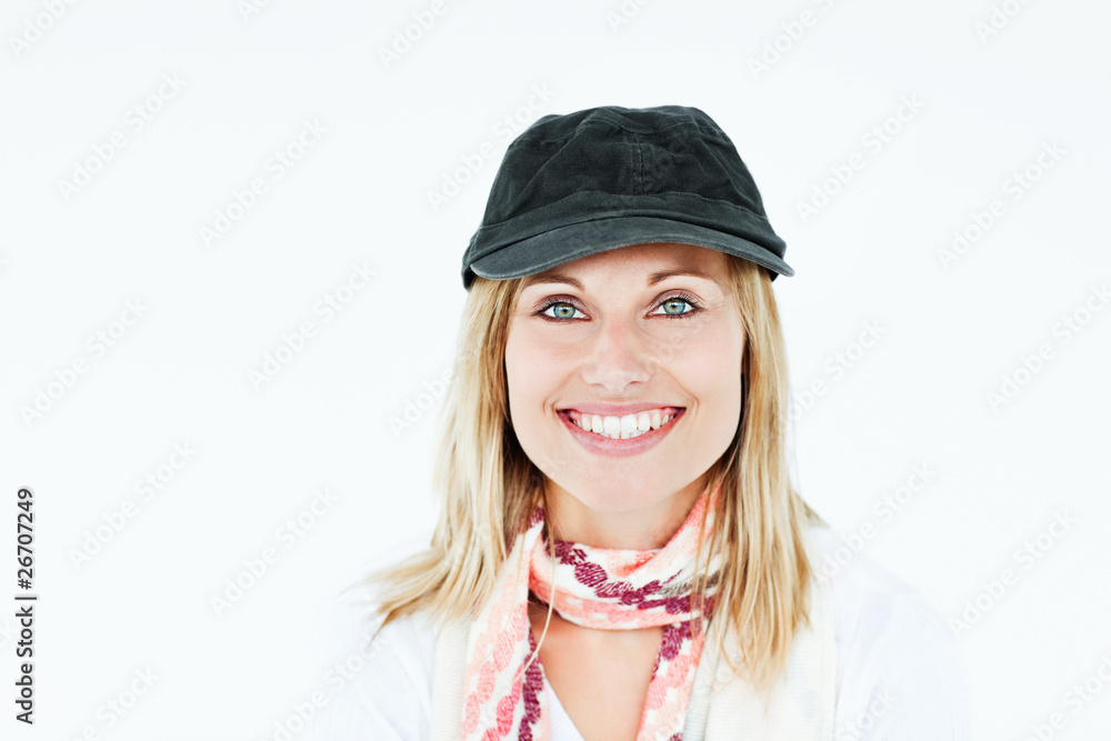 Bright blond woman with cap and scarf smiling at the camera Bright blond woman with cap and scarf smiling at the camera