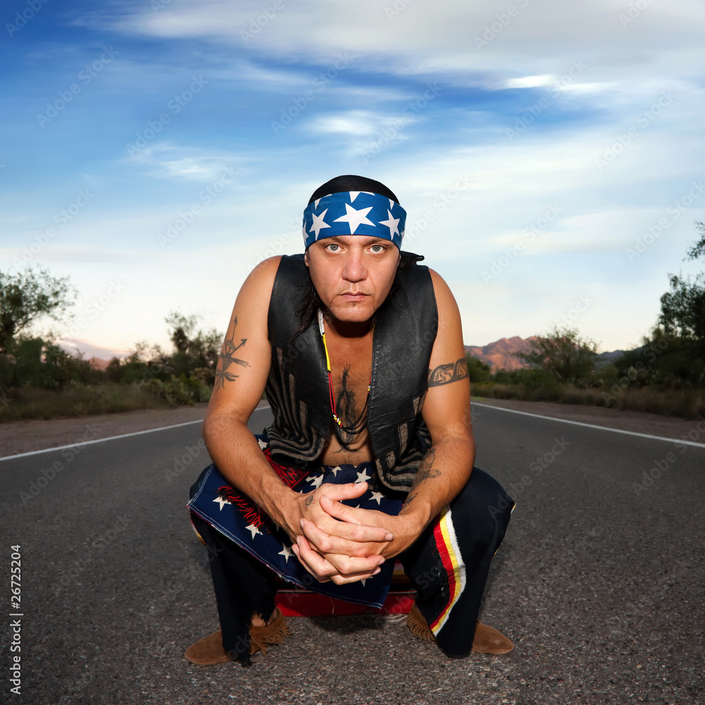 Indigenous man in the middle of a road Indigenous man in the middle of a road