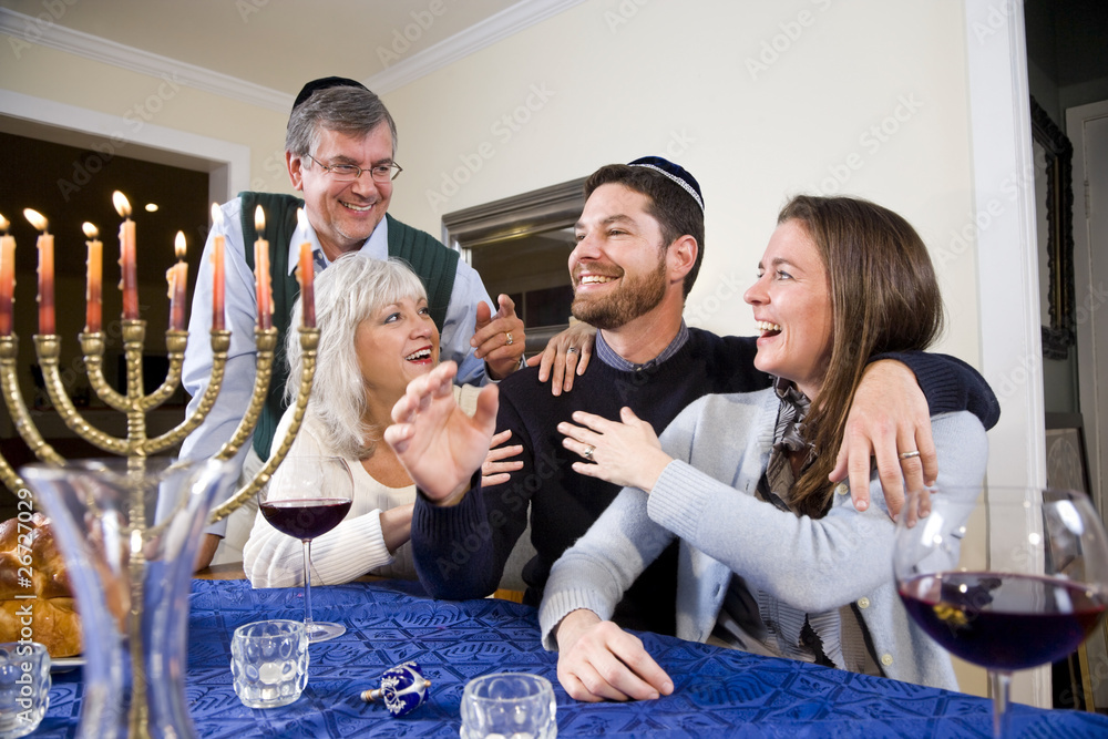 Jewish family celebrating Chanukah Jewish family celebrating Chanukah