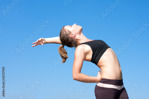 Young woman with arms outstretched