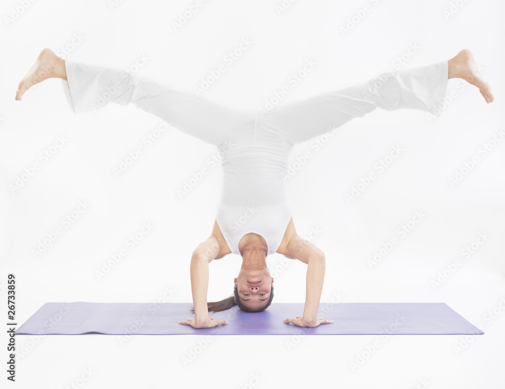 Naklejka premium professional yoga trainer in studio