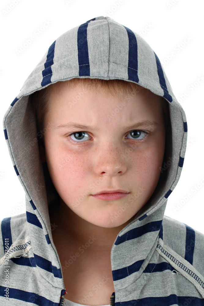 Frowned young boy in sportswear with gray hood isolated on white Frowned young boy in sportswear with gray hood isolated on white