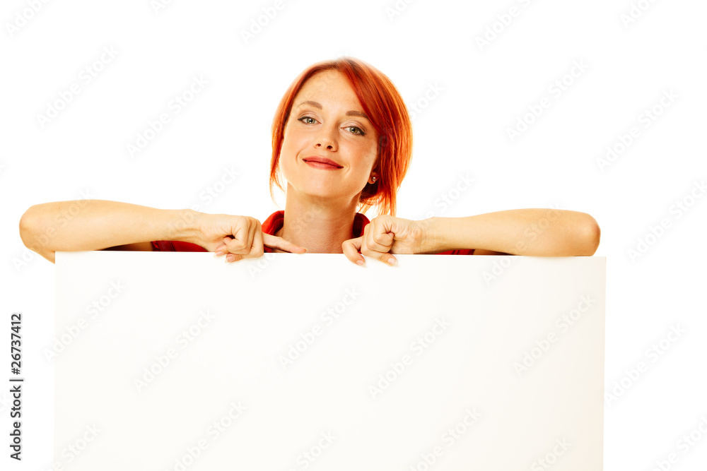 caucasian girl is holding a blank billboard caucasian girl is holding a blank billboard