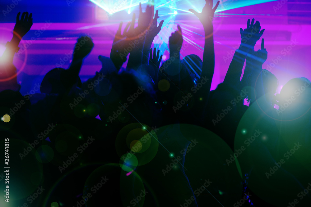 People dancing in club with laser People dancing in club with laser