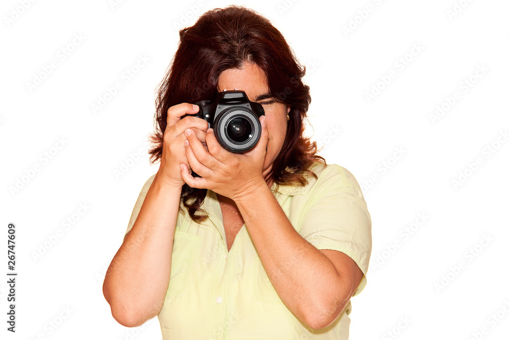 Woman using a professional camera on a white background Woman using a professional camera on a white background