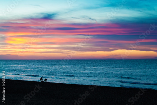 Sunset at the beach © kmiragaya