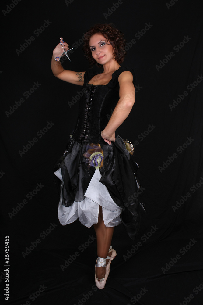 ballerina with scissors over black background ballerina with scissors over black background