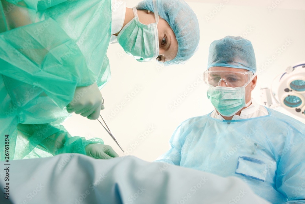Doctors operating patient Doctors operating patient