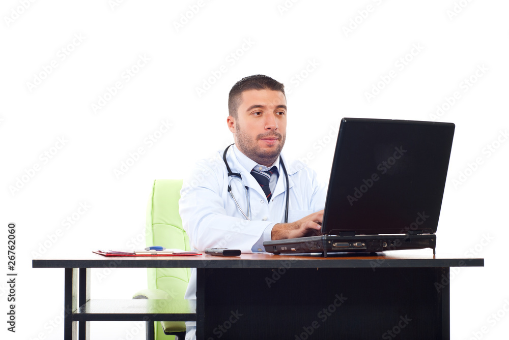 Doctor man typing on laptop in office Doctor man typing on laptop in office