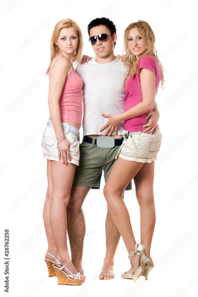 Fototapeta premium Young man and two pretty girls