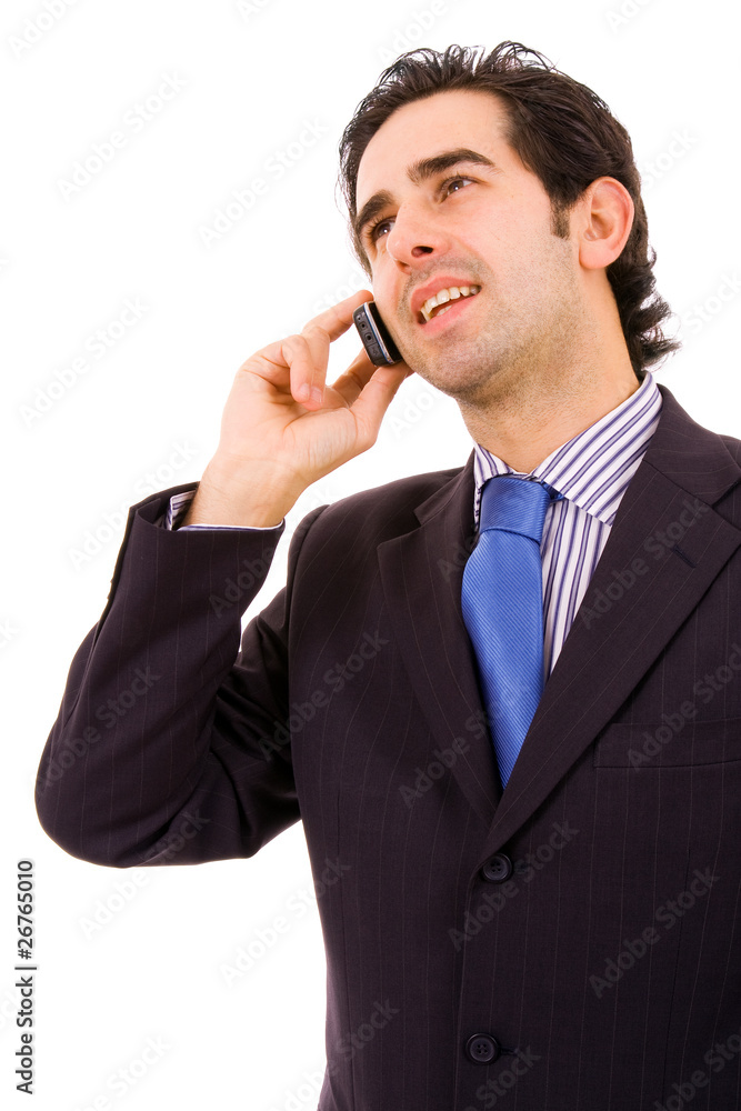 A happy young handsome business man on phone, isolated on white A happy young handsome business man on phone, isolated on white