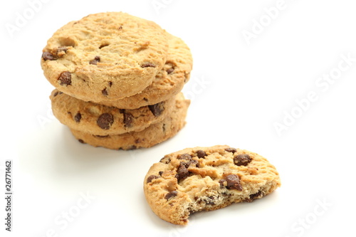 Stack of chocolate chip cookies or biscuits on white background
