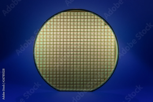 Silicon wafer with dark blue background photo
